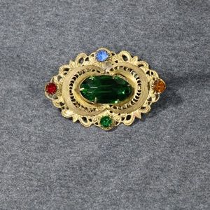vintage costume jewelry gold tone large green rhinestone brooch